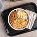 A Thunder Group Nustone White Melamine divided server on a tray with a plate of food.