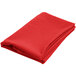A red folded cloth with a white hem.