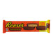 A package of Reese's King Size Milk Chocolate Peanut Butter Cups on a red background.