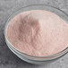 A bowl of Fanale Strawberry Pudding powder mix.