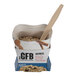 A close-up of a box of The GFB Maple Raisin Oatmeal with a spoon.