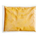A white plastic bag of Muy Fresco Plant-Based Cheddar-Style vegan cheese sauce.