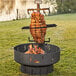 Nuke BBQ Patagonia wood fire grill with meat cooking over the fire.