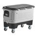 A large white and black Igloo cooler with wheels.