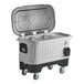 An Igloo gray mobile cooler with the lid open and wheels.