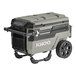 An olive green Igloo Trailmate Journey cooler with wheels and a handle.