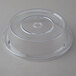 A clear plastic Cambro Camcover with a round lid on a table.