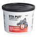 A white tub of Hercules Sta Put 25110 plumber's putty with a black lid.