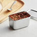 A close-up of a Matfer Bourgeat stainless steel Japanese mini container with a spoon inside.