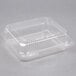A Durable Packaging clear hinged lid plastic container.