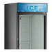 A blue sign with black letters that says "Ice" on a black refrigerator.