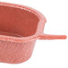 A small pink plastic Jalanino salsa server with a handle.