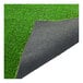 A close-up of a green artificial grass mat with black backing.