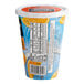 A close up of a Minute Maid Soft Frozen Orangeade cup.