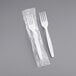 A Visions heavy weight white plastic fork individually wrapped in plastic.