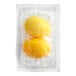A couple of yellow eggs in a plastic package.