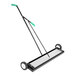 A black and white aluminum floor sweeper with a green handle.