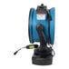 An XPOWER blue and black portable air circulator with a hose attachment.