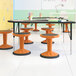 A group of Flash Furniture Carter kid's adjustable stools in a classroom.