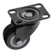 A black Avantco Refrigeration plate caster with a black wheel and metal plate.