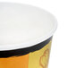 A Huhtamaki paper soup cup with a black and yellow design.