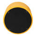 A yellow and black flexible seating circle with a black cover.