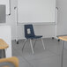 A blue Flash Furniture Mickey Advantage classroom chair with metal legs and a square cut out.