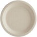 A World Centric round compostable fiber plate with a beige rim.