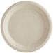 A white World Centric compostable fiber plate with a round edge.