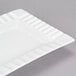 A CAC Queensquare bone white rectangular porcelain platter with a curved edge.