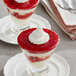 Desserts with Oregon Fruit In Hand Original Diced Raspberry with whipped cream on top.
