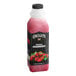 A plastic bottle of Oregon Fruit In Hand Original Diced Strawberry with Diced Fruit juice concentrate with diced strawberries on the label.