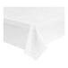 A folded white plastic table cover on a white surface.
