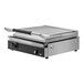 A Vollrath stainless steel panini grill with smooth plates and a black handle.