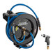 A blue and black Regency hose reel with a hose and spray nozzle.