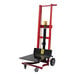 A red and black Wesco Industrial Products hydraulic pedalift with a black platform.