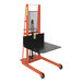 A black and orange Wesco Industrial Products hydraulic lift truck with a platform on it.