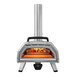 A silver and black Ooni Karu 16 outdoor pizza oven with a fire inside.