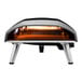 A black and silver Ooni Koda 16 outdoor pizza oven on a table.
