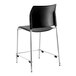 A National Public Seating black vinyl cafetorium stool with chrome legs.