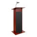 A mahogany Oklahoma Sound lectern with a microphone.
