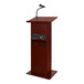 A wooden Oklahoma Sound lectern with a microphone.