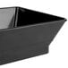 A black polyethylene rectangular plastic basket with a handle.