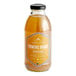 A bottle of Harney & Sons American Buzz Organic Turmeric Orange Iced Tea on a counter with a label.