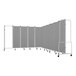 A National Public Seating mobile room divider with 11 gray panels and a gray metal frame on wheels.