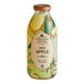 A close up of a Harney & Sons Organic Apple Juice bottle with a label and green leaf design.