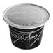 A black and white Lavazza Espresso Maestro Dek decaf coffee capsule with a white lid.