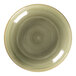A close-up of a green RAK Porcelain deep coupe plate with a spiral design.