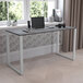A Flash Furniture Tiverton office desk with a laptop on it.