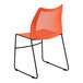 An orange Flash Furniture Hercules stacking chair with a black frame.